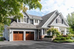 Modern suburban house with two-car garage.